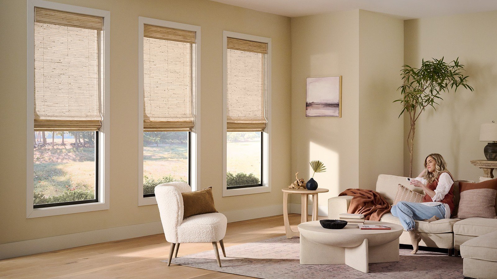 Natural woven shades living room san tan valley az - Pearl & Co Natural woven shades in a sunny San Tan Valley AZ living room