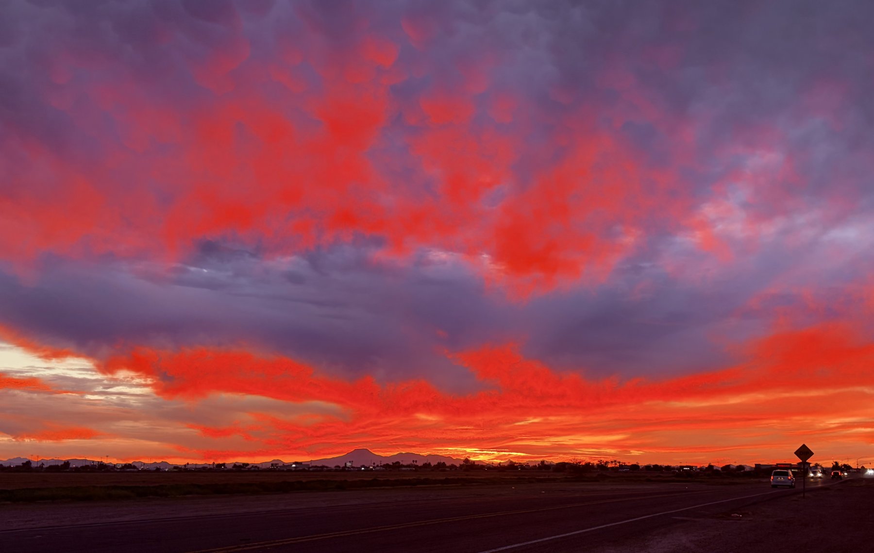 arizona-red-sunset-sky - Pearl & Co Bright red and purple Arizona sunset sky over the desert