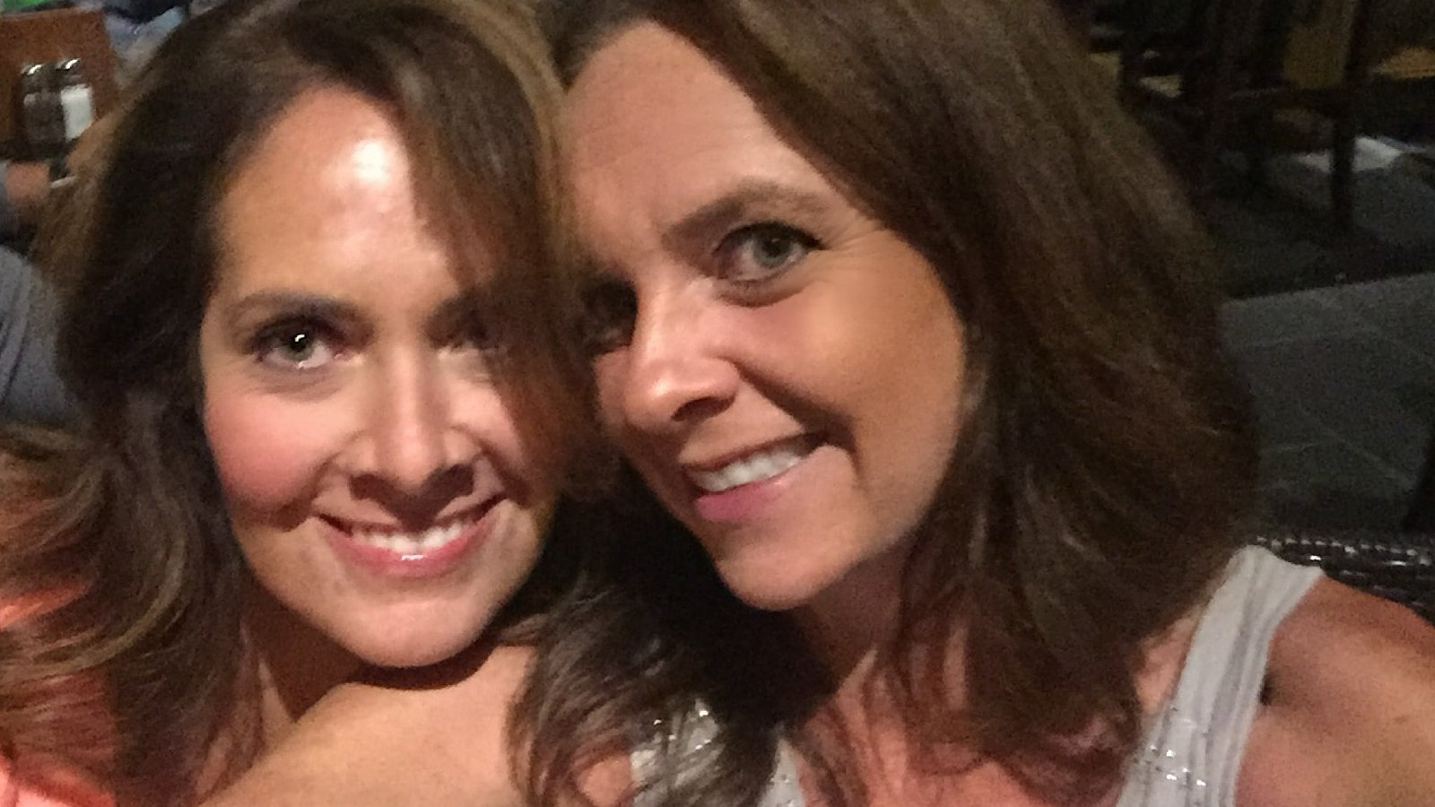 Two smiling women posing together for a selfie